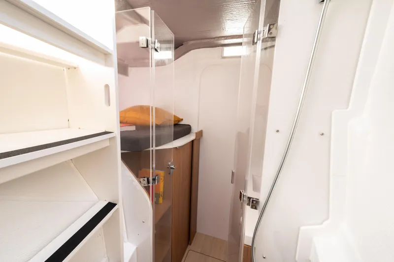  Yacht Photos Pics Interior of 2026 Bali 5.2 yacht cabin with modern design and storage shelves.