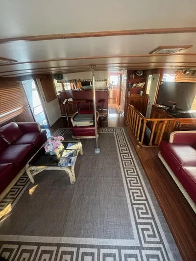 Majestic Yacht Photos Pics 1987 Marine Trader 62 Med Yacht interior with luxurious seating and elegant decor.