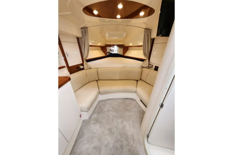  Yacht Photos Pics Luxurious interior of 2004 Pershing 37 yacht with plush seating and elegant lighting.