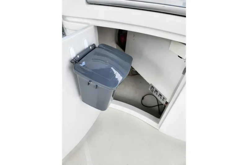  Yacht Photos Pics Trash bin inside a 2004 Pershing 37 yacht's storage compartment.