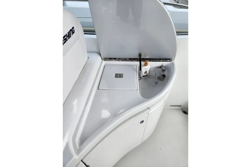  Yacht Photos Pics 2004 Pershing 37 yacht interior with sink and storage area.