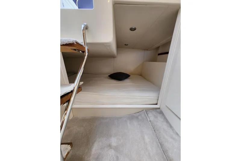  Yacht Photos Pics Interior cabin of 2004 Pershing 37 yacht with cozy sleeping area.