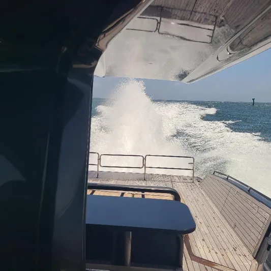  Yacht Photos Pics Anvera 55 yacht cruising on open water, rear view, 2016 model.