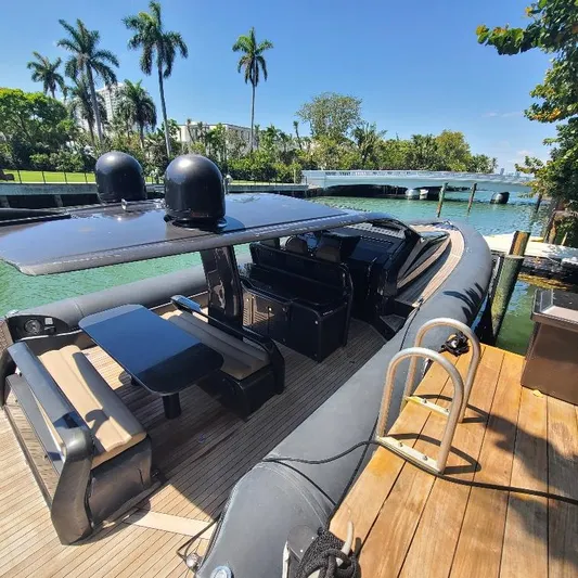  Yacht Photos Pics Luxury Anvera 55 yacht docked by tropical waters, showcasing sleek design and modern amenities.