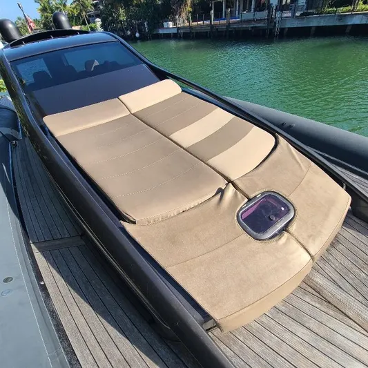  Yacht Photos Pics Luxurious sunbed on 2016 Anvera 55 yacht, docked by serene waters.