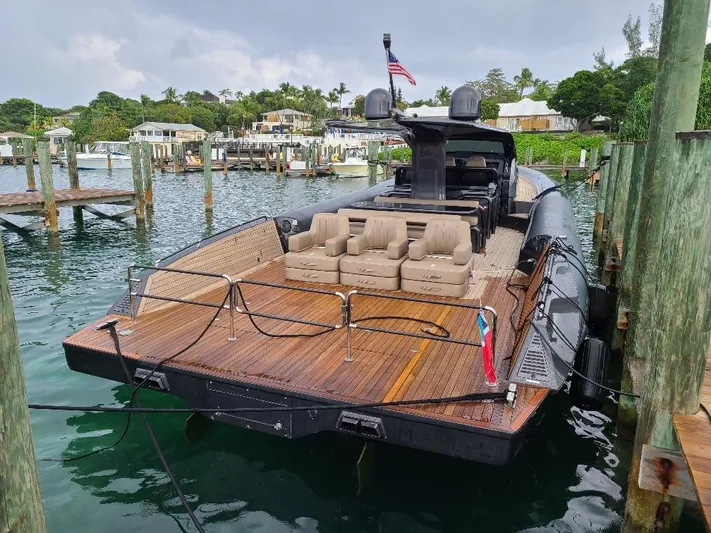  Yacht Photos Pics Luxury Anvera 55 yacht docked at marina, showcasing sleek design and spacious deck.
