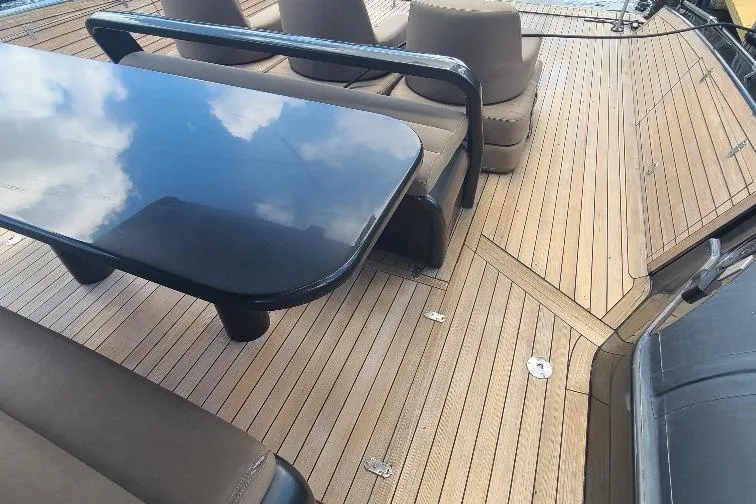  Yacht Photos Pics Luxurious Anvera 55 yacht deck with sleek seating and glossy table, 2016 model.