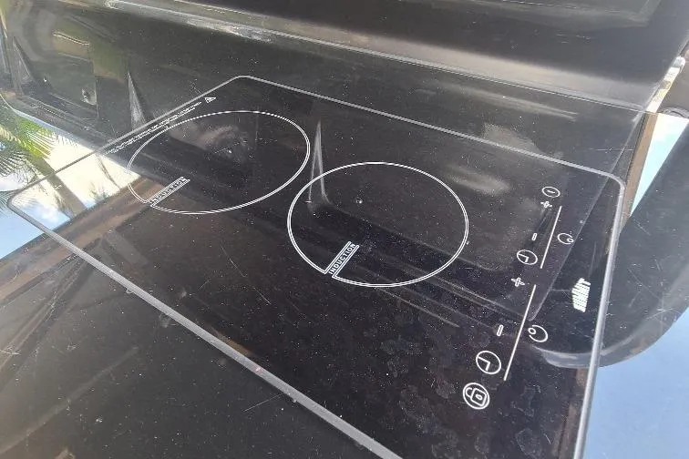  Yacht Photos Pics Sleek black induction cooktop on Anvera 55 yacht, 2016 model.