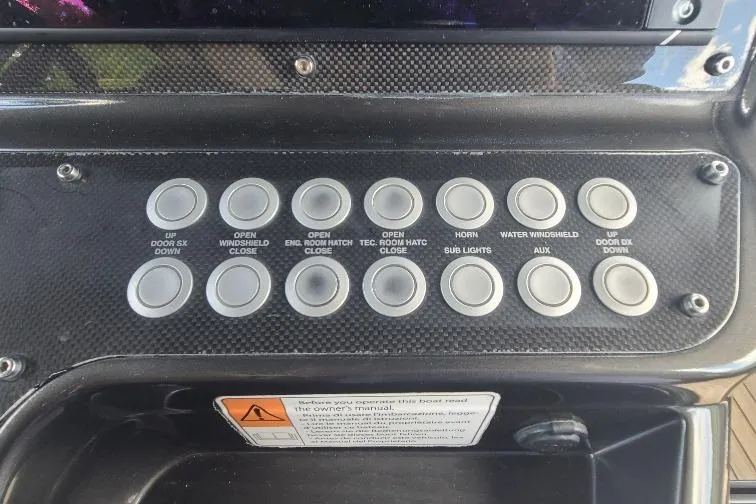  Yacht Photos Pics Control panel of a 2016 Anvera 55 boat with labeled buttons for various functions.