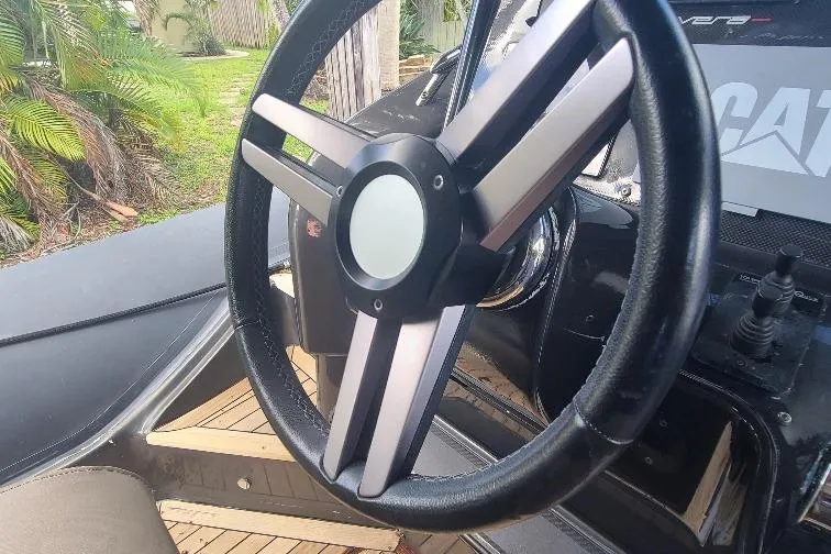  Yacht Photos Pics Steering wheel of a 2016 Anvera 55 boat, featuring sleek design and modern controls.