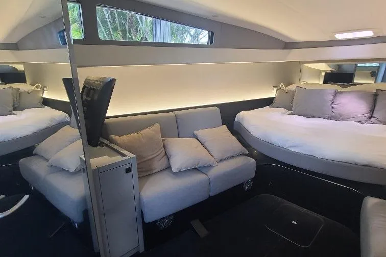  Yacht Photos Pics Luxurious interior of 2016 Anvera 55 yacht with modern seating and bedding.