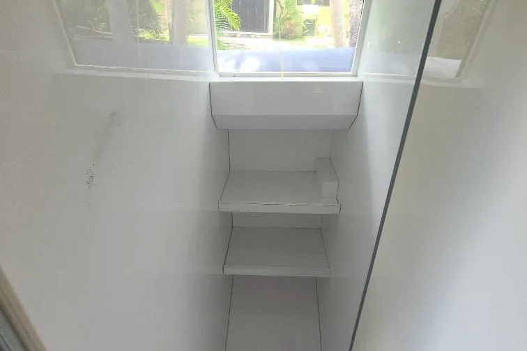  Yacht Photos Pics Interior view of 2016 Anvera 55 boat with white shelves and window.