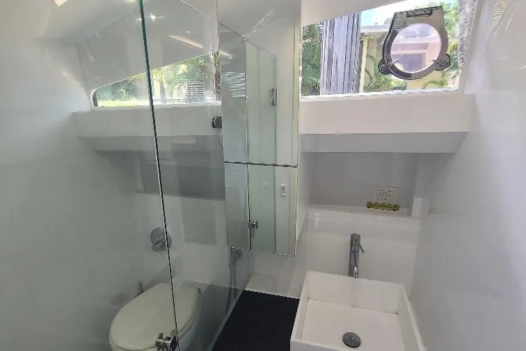  Yacht Photos Pics Modern bathroom in 2016 Anvera 55 yacht with glass shower and porthole window.