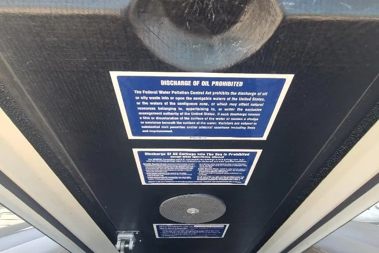  Yacht Photos Pics Warning signs on Anvera 55 boat, 2016 model, prohibiting oil and garbage discharge.