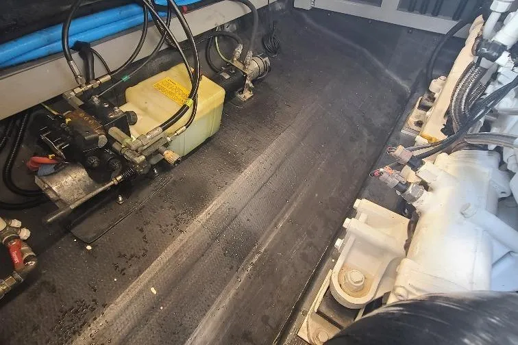  Yacht Photos Pics Engine compartment of a 2016 Anvera 55 boat, showcasing mechanical components and wiring.