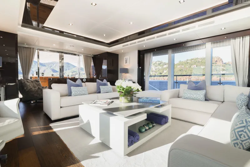 King Power Yacht Photos Pics Luxurious interior of 2016 Sunseeker 116 Yacht with elegant seating and scenic ocean views.