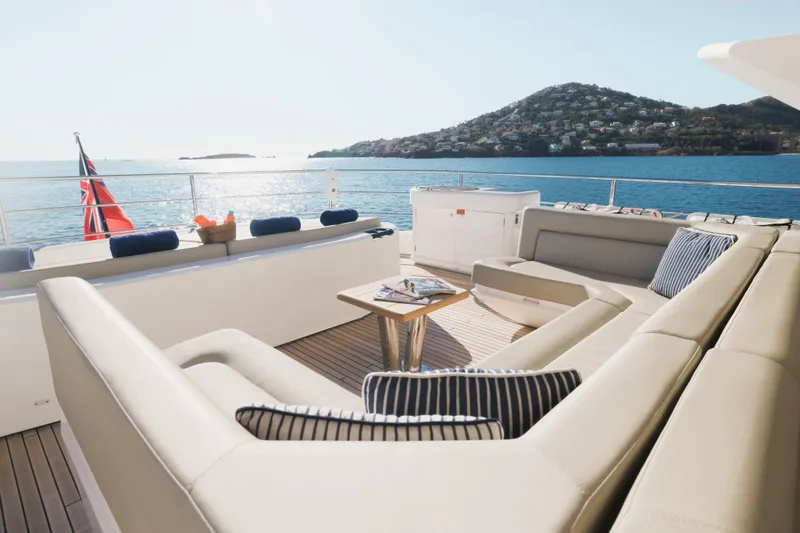 King Power Yacht Photos Pics Luxurious Sunseeker 116 Yacht deck with elegant seating, ocean view, and scenic backdrop, 2016 model.