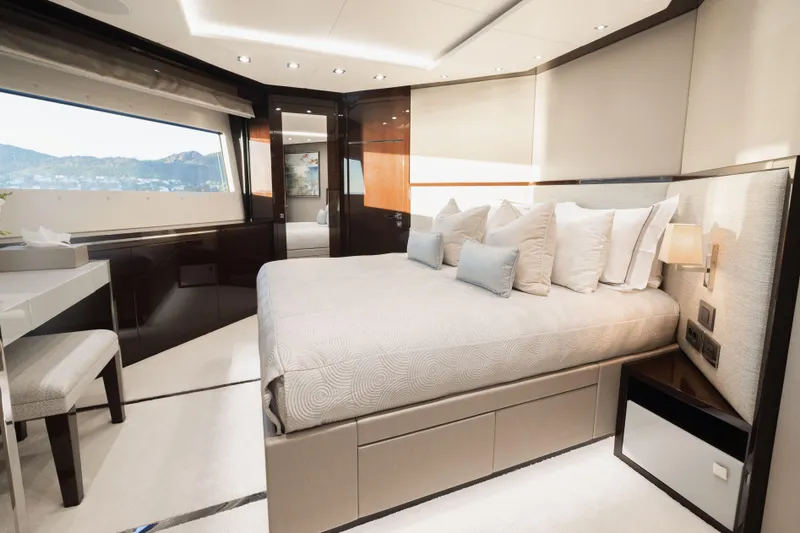 King Power Yacht Photos Pics Luxurious bedroom interior on 2016 Sunseeker 116 Yacht, featuring elegant design and large window views.