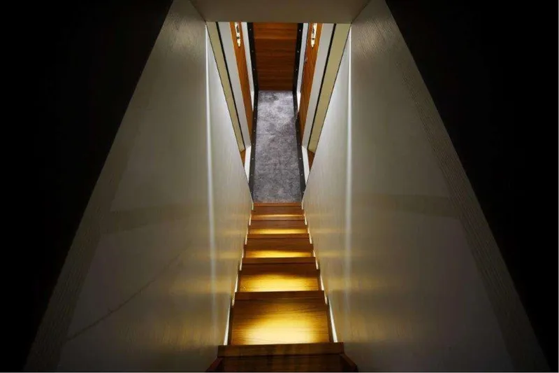  Yacht Photos Pics Illuminated wooden staircase inside 2011 Otam 80 HT yacht, featuring modern design and ambient lighting.