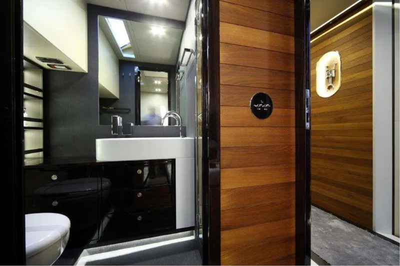  Yacht Photos Pics Luxurious bathroom interior of 2011 Otam 80 HT yacht with modern fixtures and wood accents.