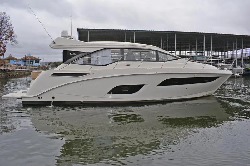  Yacht Photos Pics 2017 Sea Ray Sundancer 460 yacht docked in marina, side view.