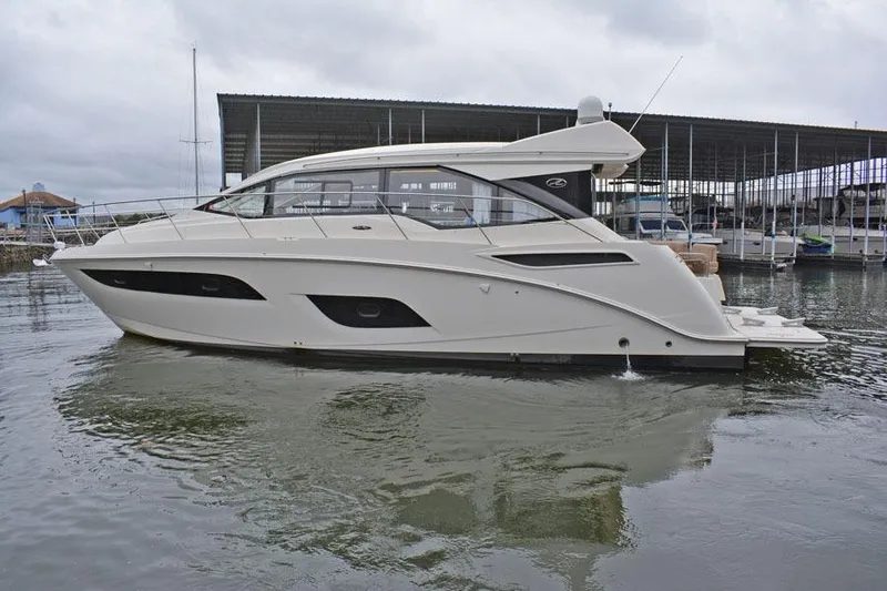  Yacht Photos Pics 2017 Sea Ray Sundancer 460 yacht docked in a marina, side view.