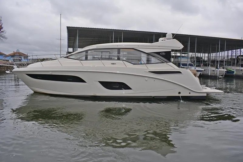  Yacht Photos Pics 2017 Sea Ray Sundancer 460 yacht docked in a marina, side view.