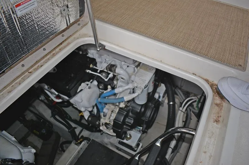  Yacht Photos Pics Engine compartment of a 2017 Sea Ray Sundancer 460 boat, showcasing mechanical components.