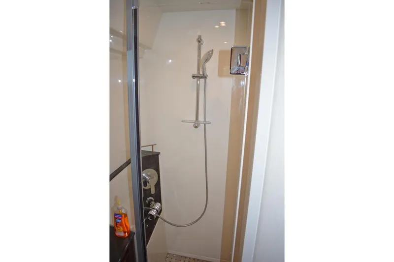  Yacht Photos Pics Shower area in 2017 Sea Ray Sundancer 460 yacht, featuring modern fixtures and glass door.