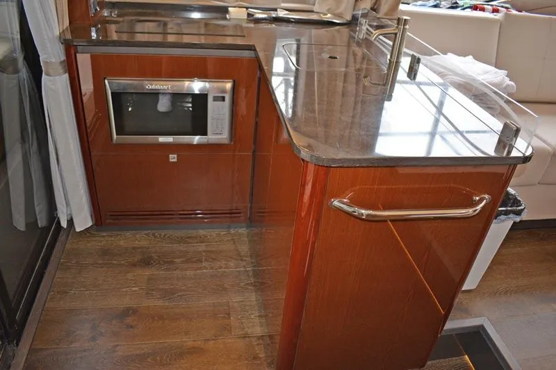  Yacht Photos Pics 2017 Sea Ray Sundancer 460 yacht kitchen with microwave and sleek countertops.
