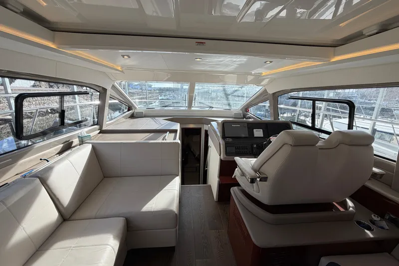  Yacht Photos Pics Luxurious interior of 2017 Sea Ray Sundancer 460 yacht with modern seating and helm.