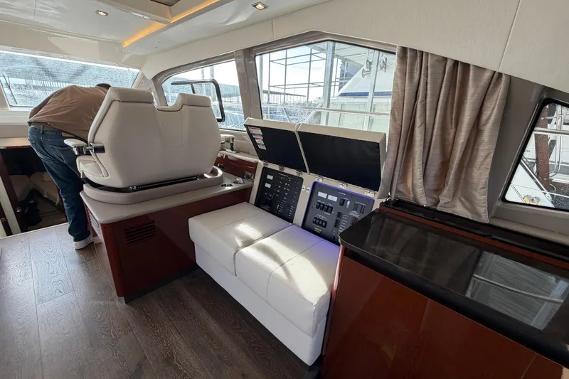  Yacht Photos Pics Interior of 2017 Sea Ray Sundancer 460 yacht with modern helm and seating area.