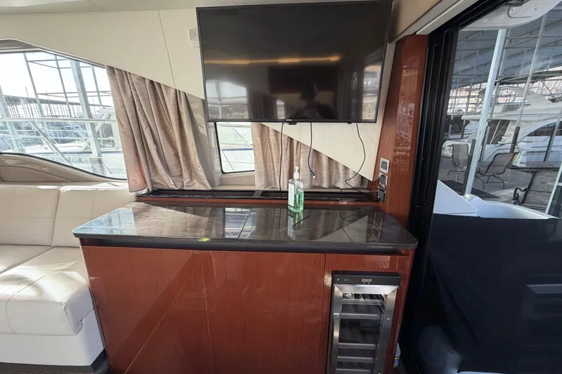  Yacht Photos Pics Luxurious interior of 2017 Sea Ray Sundancer 460 yacht with TV and minibar.