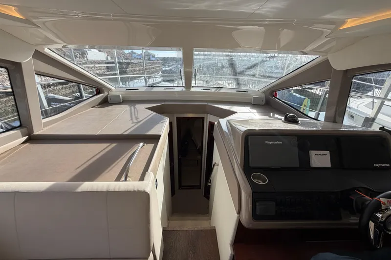  Yacht Photos Pics Interior view of 2017 Sea Ray Sundancer 460 yacht cockpit with navigation equipment.