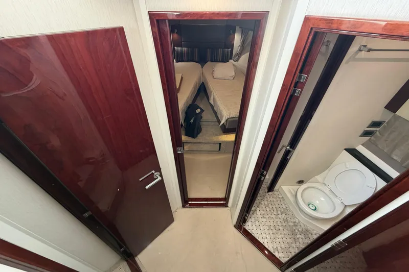  Yacht Photos Pics Interior view of 2017 Sea Ray Sundancer 460 yacht, featuring bedroom and bathroom.