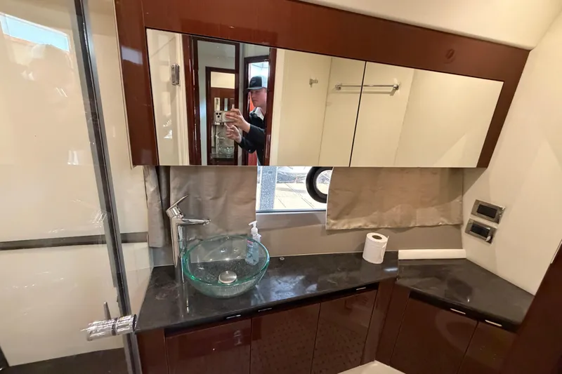  Yacht Photos Pics Luxurious bathroom interior of 2017 Sea Ray Sundancer 460 yacht with modern fixtures.