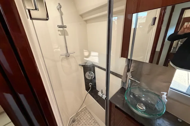  Yacht Photos Pics Luxurious bathroom in 2017 Sea Ray Sundancer 460 yacht with glass sink and shower.