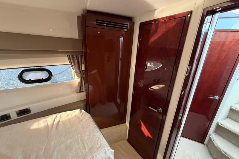  Yacht Photos Pics Interior of 2017 Sea Ray Sundancer 460 yacht with wooden doors and window.