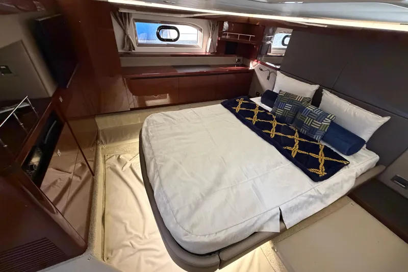  Yacht Photos Pics Luxurious cabin interior of 2017 Sea Ray Sundancer 460 yacht with elegant bedding.