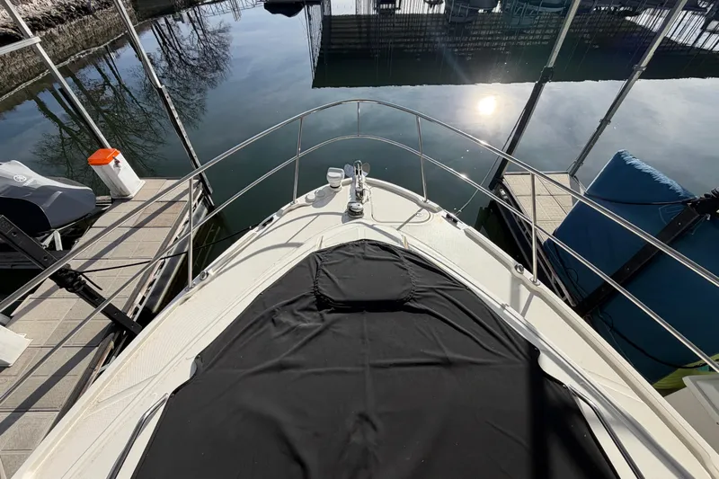  Yacht Photos Pics 2017 Sea Ray Sundancer 460 yacht docked, sun reflecting on calm water.