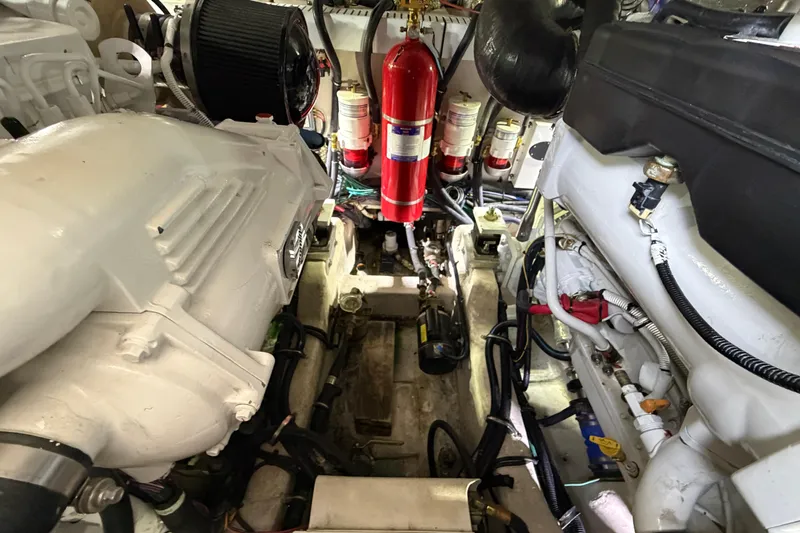  Yacht Photos Pics Engine room of 2017 Sea Ray Sundancer 460 with visible components and fire extinguisher.