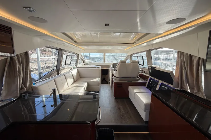  Yacht Photos Pics Luxurious interior of 2017 Sea Ray Sundancer 460 yacht with modern seating and helm.