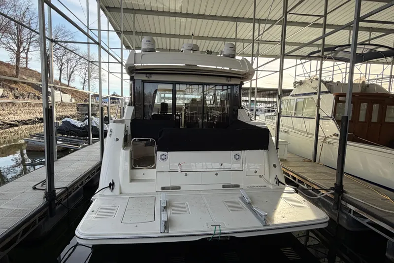  Yacht Photos Pics 2017 Sea Ray Sundancer 460 yacht docked in a marina, rear view.