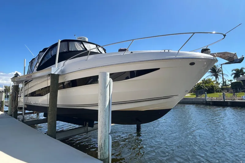 Yacht Photos Pics 2014 Sea Ray 370 Venture boat docked on a sunny day.