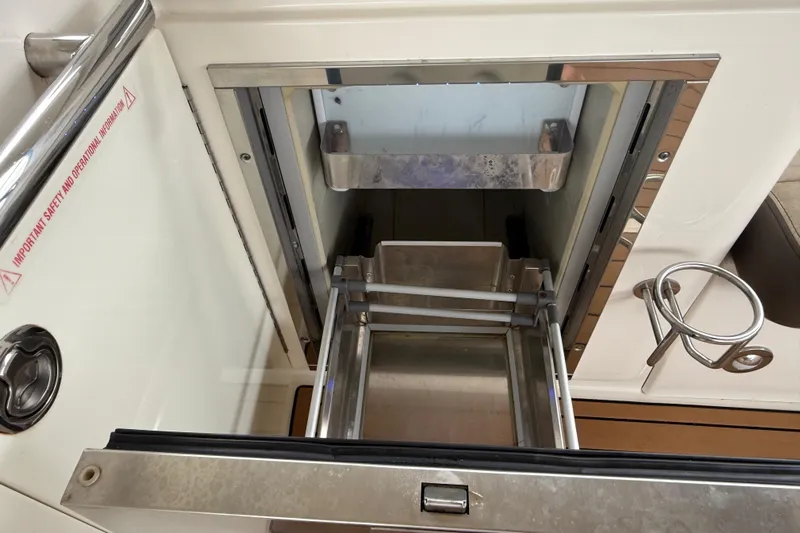  Yacht Photos Pics Open storage compartment on 2014 Sea Ray 370 Venture boat, featuring stainless steel details.