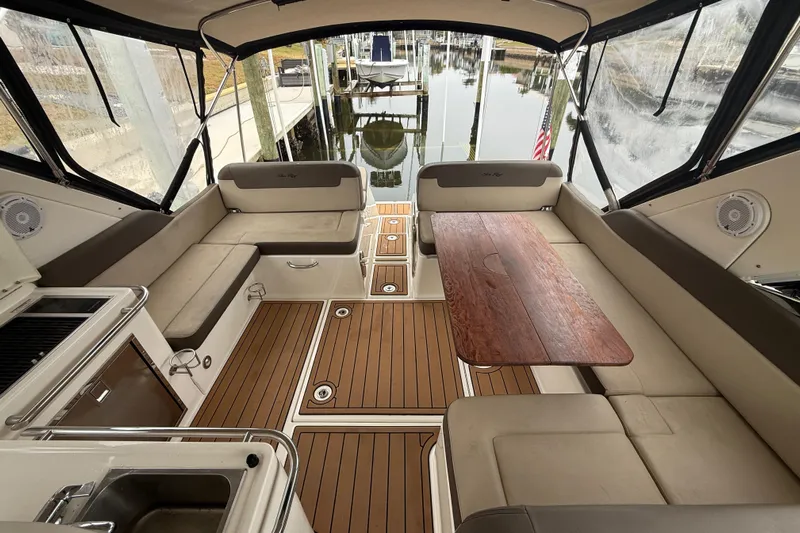  Yacht Photos Pics Luxurious interior of 2014 Sea Ray 370 Venture yacht with seating and wooden table.
