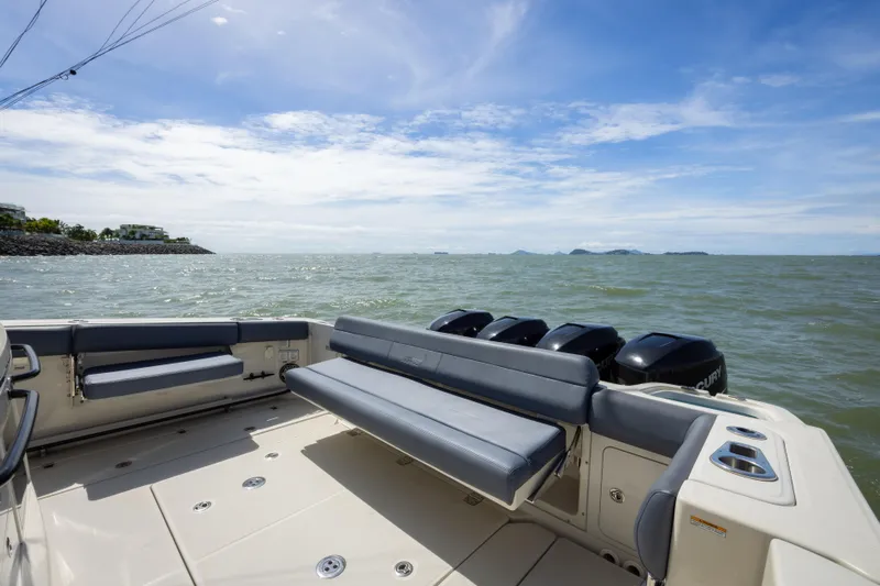Pachanga Yacht Photos Pics 2021 Boston Whaler 420 Outrage boat with seating, ocean view, and clear sky.