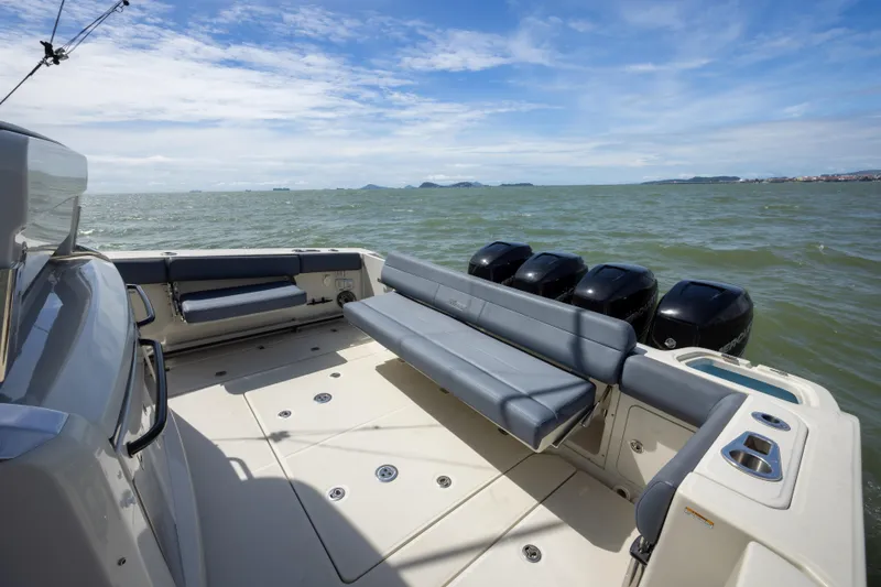 Pachanga Yacht Photos Pics 2021 Boston Whaler 420 Outrage boat with spacious deck and multiple engines on open water.