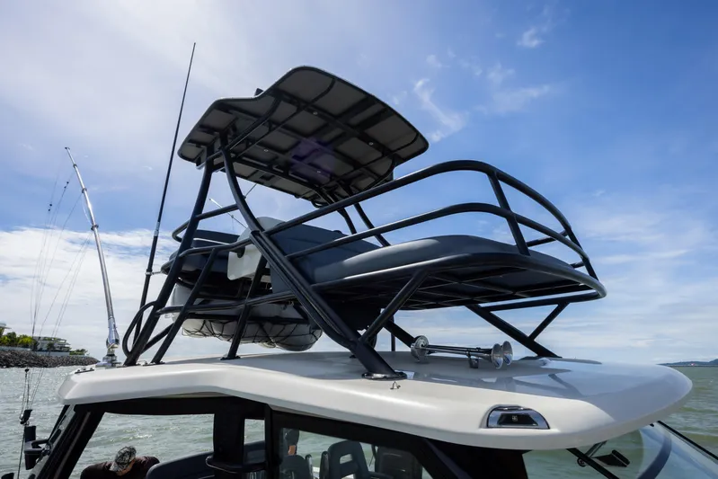 Pachanga Yacht Photos Pics 2021 Boston Whaler 420 Outrage boat with elevated seating and fishing rods.