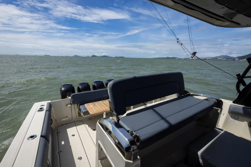 Pachanga Yacht Photos Pics 2021 Boston Whaler 420 Outrage boat on open water, featuring spacious seating and multiple engines.